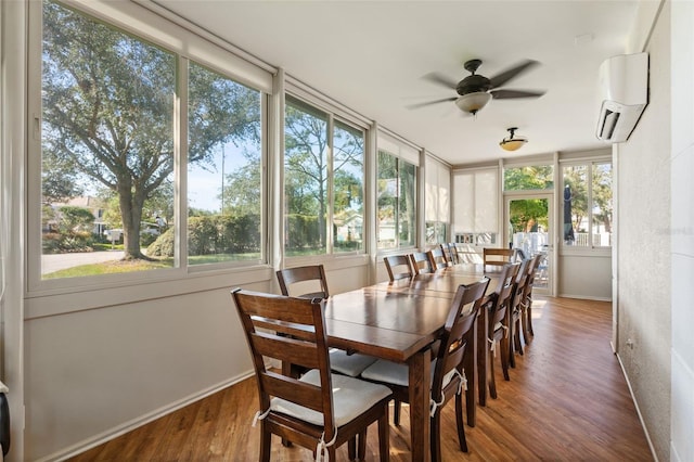 sunroom featuring a wall mounted air conditioner and ceiling fan