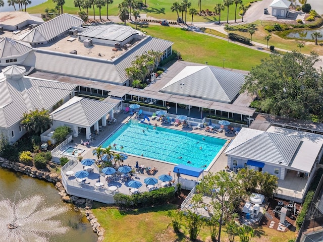 birds eye view of property with a water view