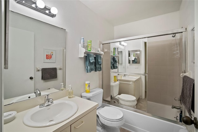 full bathroom featuring vanity, shower / bath combination with glass door, and toilet