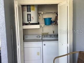 laundry area with independent washer and dryer and water heater