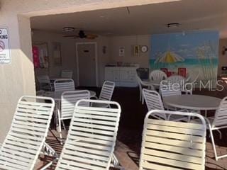 view of patio / terrace featuring ceiling fan