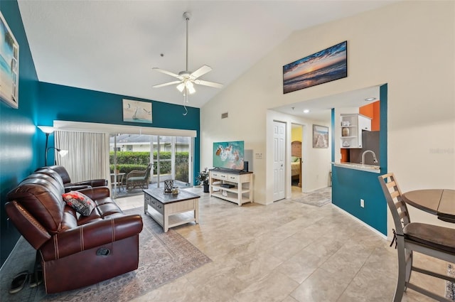 living room with ceiling fan and high vaulted ceiling