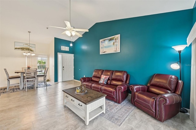 living room with high vaulted ceiling and ceiling fan