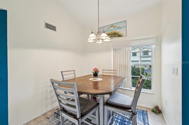 dining space featuring vaulted ceiling and a notable chandelier