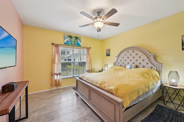 bedroom with light tile patterned flooring and ceiling fan