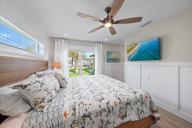 bedroom with access to outside, ceiling fan, and light hardwood / wood-style flooring