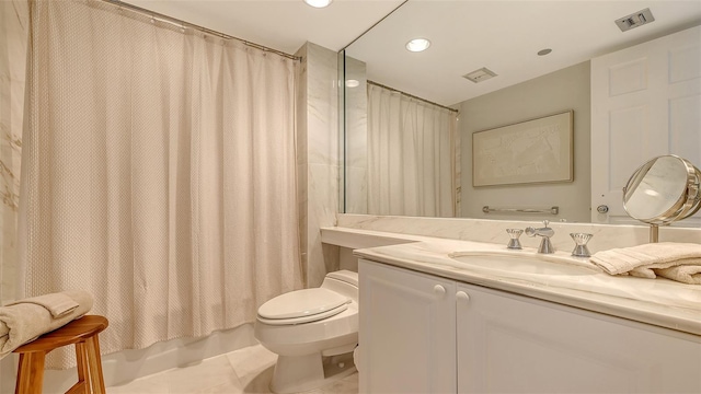 full bathroom featuring tile patterned flooring, vanity, shower / tub combo, and toilet