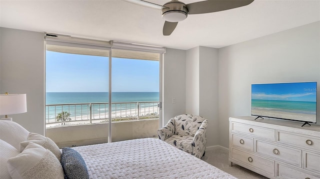 bedroom featuring ceiling fan, light colored carpet, and access to exterior