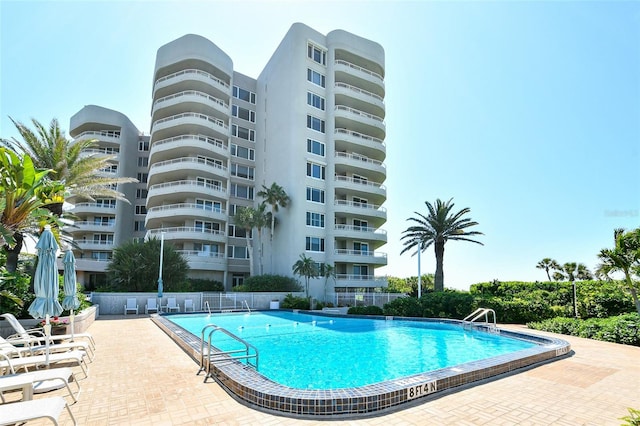 view of swimming pool featuring a patio area