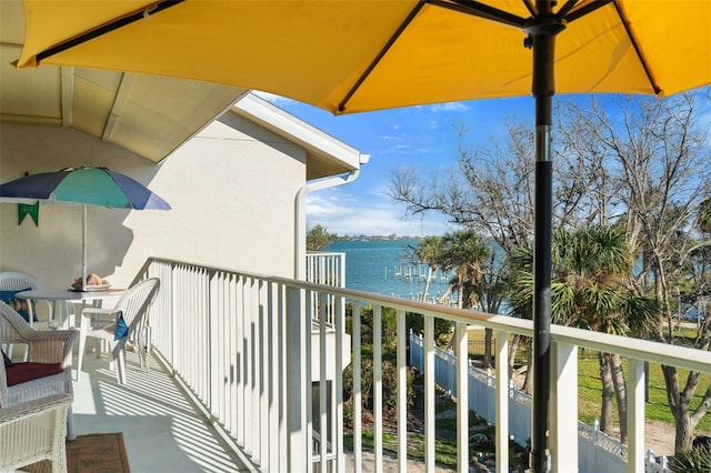 balcony featuring a water view