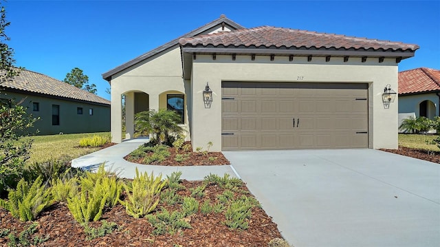 mediterranean / spanish-style house featuring a garage