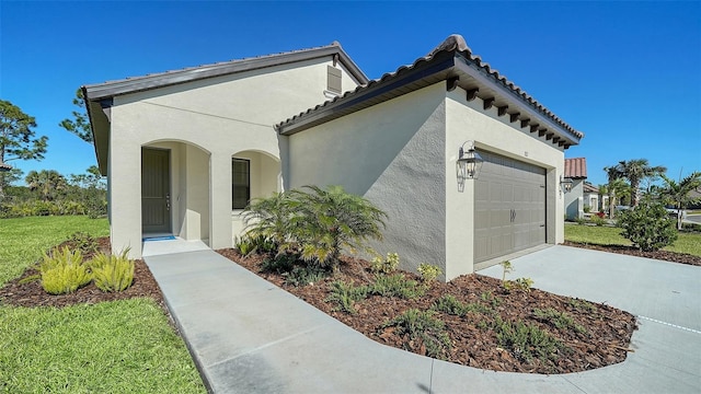 view of home's exterior featuring a garage and a yard