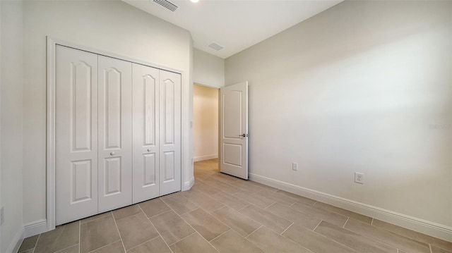 unfurnished bedroom with a closet