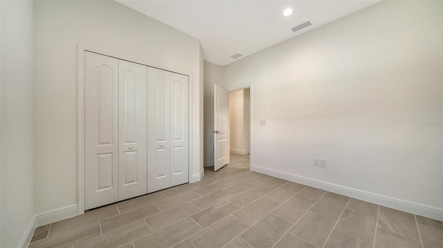 unfurnished bedroom featuring a closet