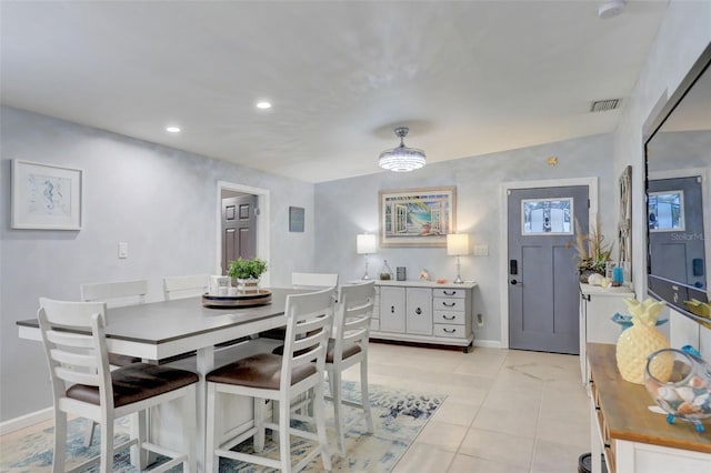 dining area with recessed lighting, light tile patterned flooring, visible vents, and baseboards