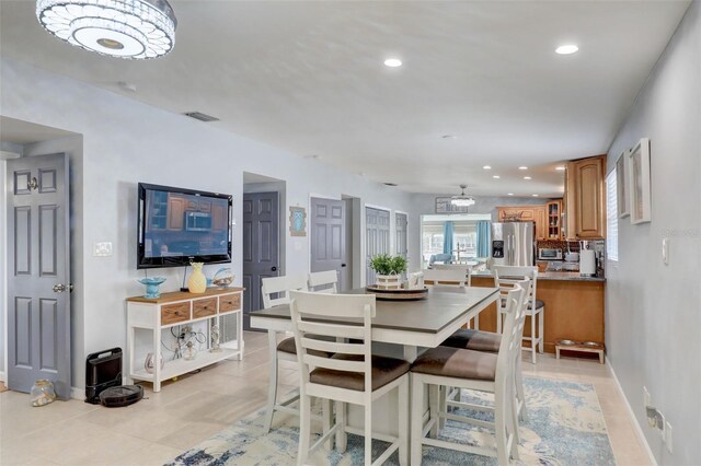 dining area with light tile patterned floors, baseboards, visible vents, and recessed lighting