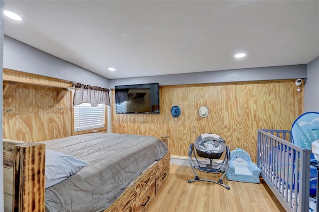 bedroom featuring wood finished floors and recessed lighting