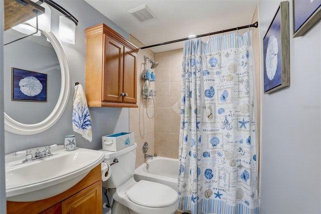 full bathroom featuring toilet, vanity, visible vents, and shower / tub combo with curtain