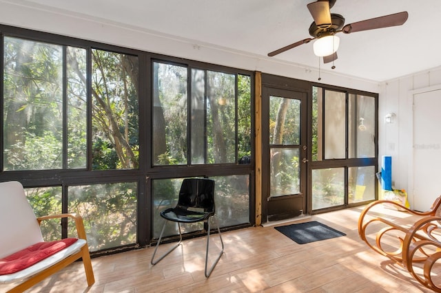 sunroom / solarium with ceiling fan