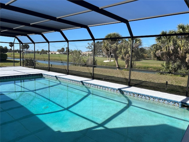 view of swimming pool featuring a water view and glass enclosure