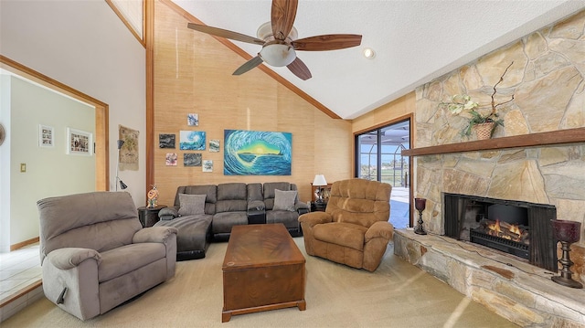 carpeted living room featuring a ceiling fan, a fireplace, high vaulted ceiling, and a textured ceiling