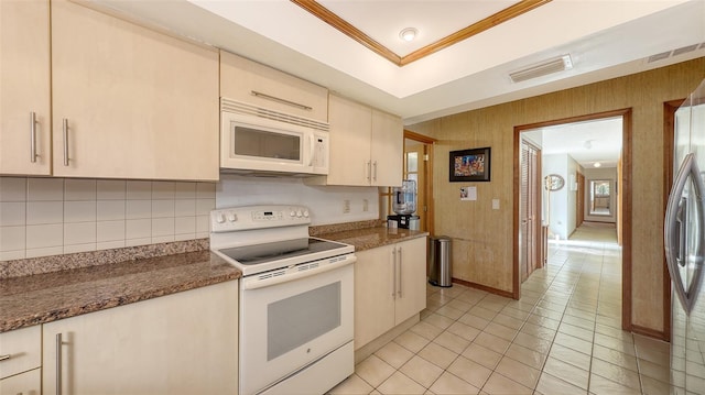 kitchen featuring white appliances, tasteful backsplash, visible vents, a raised ceiling, and crown molding