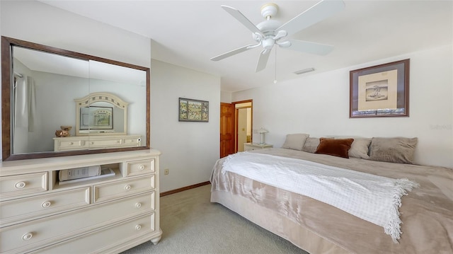 bedroom with baseboards, ceiling fan, visible vents, and light colored carpet