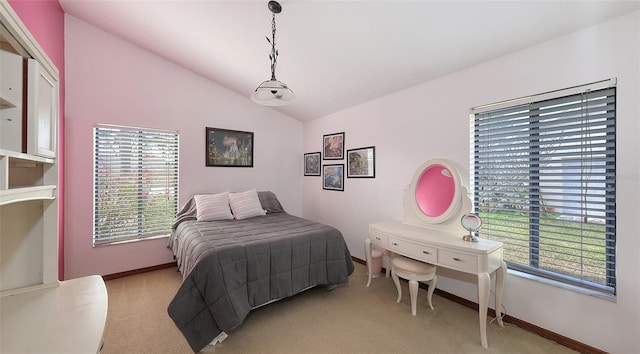 bedroom featuring vaulted ceiling, baseboards, and light colored carpet