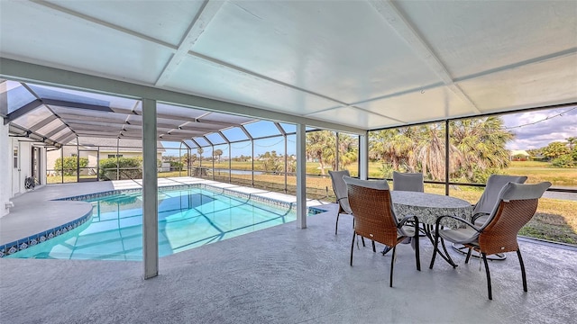 pool with a lanai and a patio area