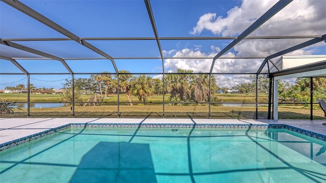 outdoor pool featuring a patio area, a lanai, and a water view