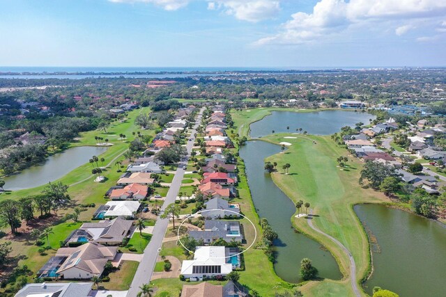 aerial view featuring a water view, a residential view, and golf course view