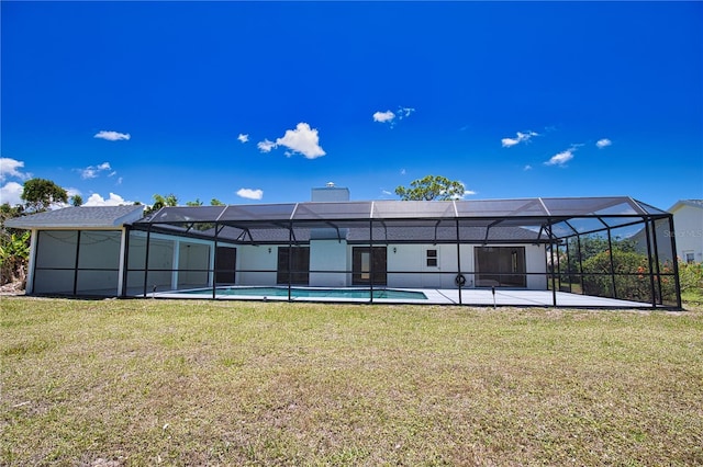 3837 Torrey Pines Blvd, Sarasota, FL 34238 - rear view of house featuring a yard, an outdoor pool, glass enclosure, and a patio area
