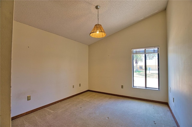 3837 Torrey Pines Blvd, Sarasota, FL 34238 - spare room featuring light carpet, vaulted ceiling, a textured ceiling, and baseboards
