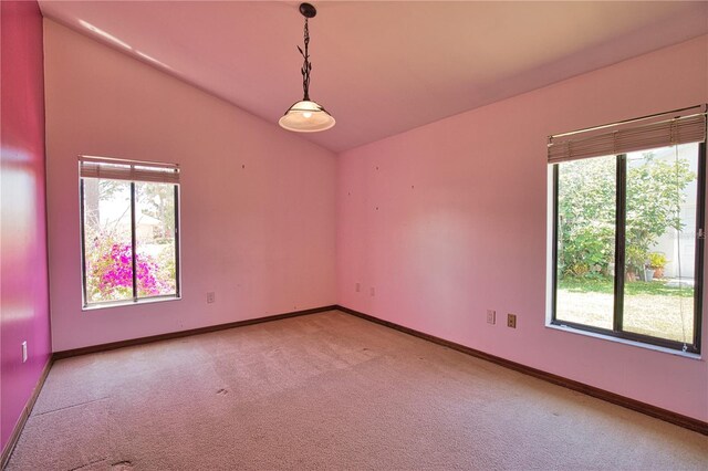 3837 Torrey Pines Blvd, Sarasota, FL 34238 - empty room with vaulted ceiling, healthy amount of natural light, light carpet, and baseboards