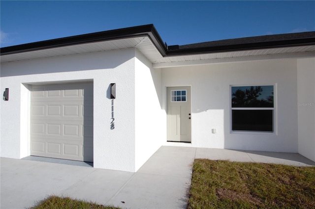 property entrance featuring a garage