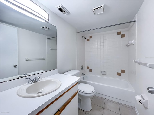 full bathroom featuring tile patterned flooring, vanity, tiled shower / bath combo, and toilet