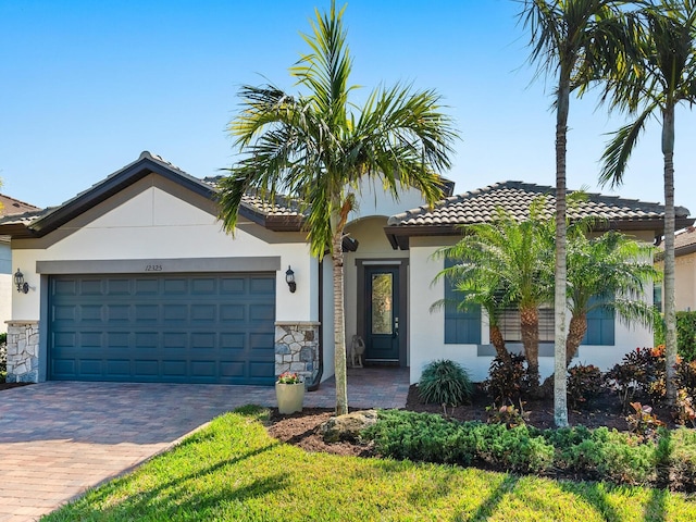 mediterranean / spanish-style home with a garage