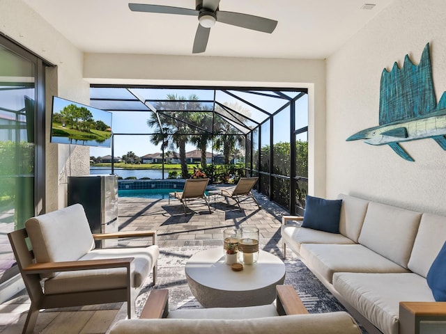 sunroom / solarium featuring ceiling fan