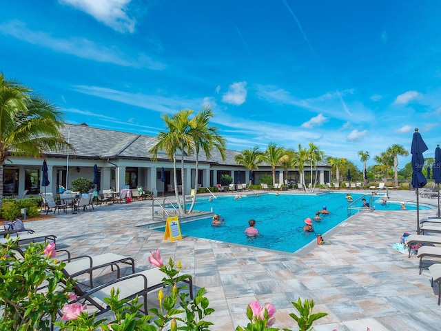 view of swimming pool with a patio