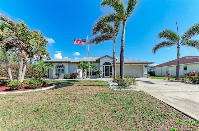 ranch-style home with a garage and a front yard