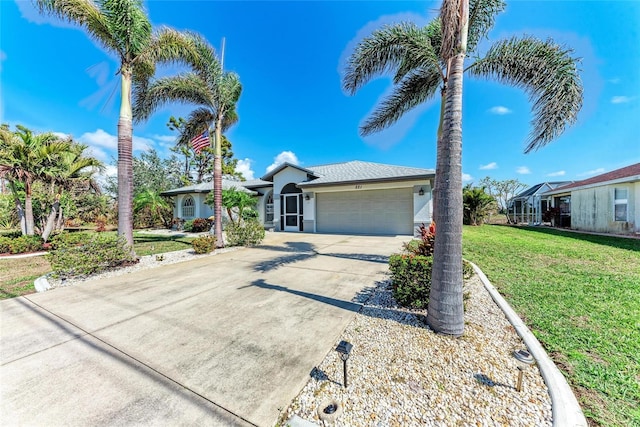 ranch-style house with a garage and a front yard