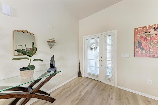 foyer entrance with light wood-type flooring