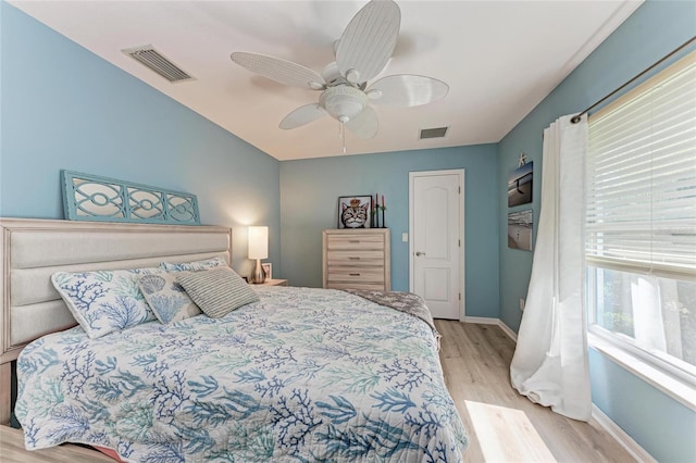 bedroom with ceiling fan and light hardwood / wood-style flooring