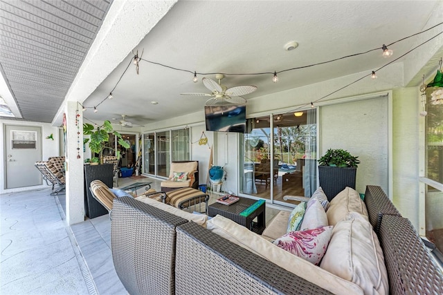 view of patio / terrace with an outdoor living space and ceiling fan