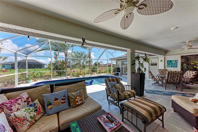 exterior space featuring outdoor lounge area, ceiling fan, and glass enclosure