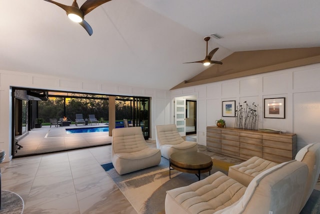 living room with ceiling fan and lofted ceiling