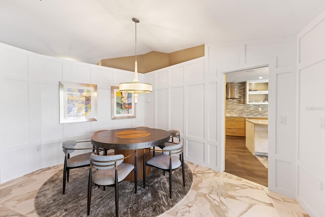 dining room with lofted ceiling