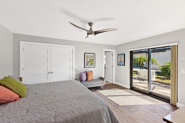 bedroom with access to exterior, wood-type flooring, a closet, and ceiling fan