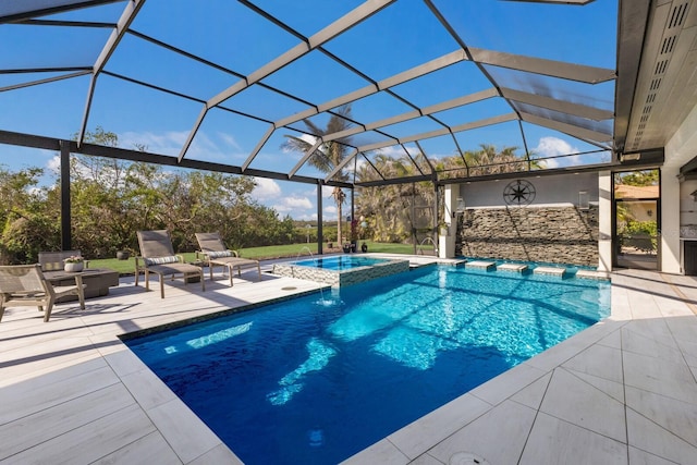 view of pool with an in ground hot tub, a patio, and glass enclosure