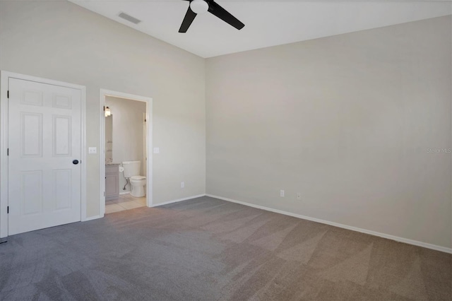 empty room featuring ceiling fan and light colored carpet